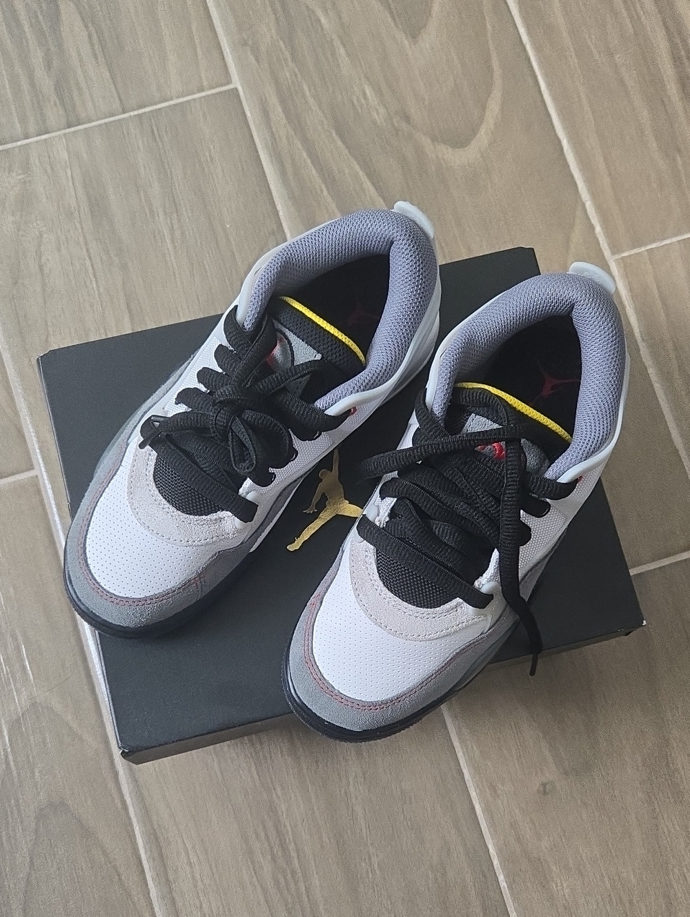 Air Jordan 4 RM Kids White, Black & Gray Low-Top Sneakers with Yellow Accents